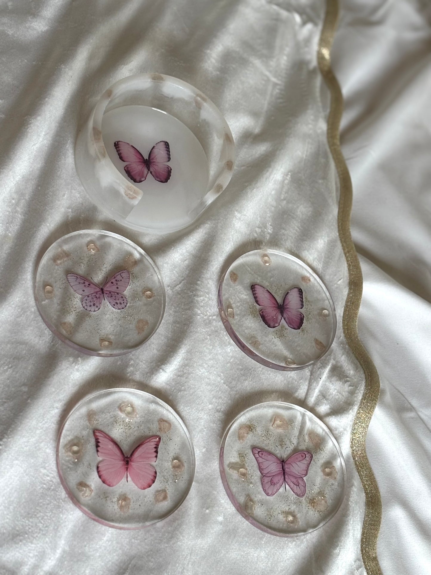 Pink butterfly resin coasters.