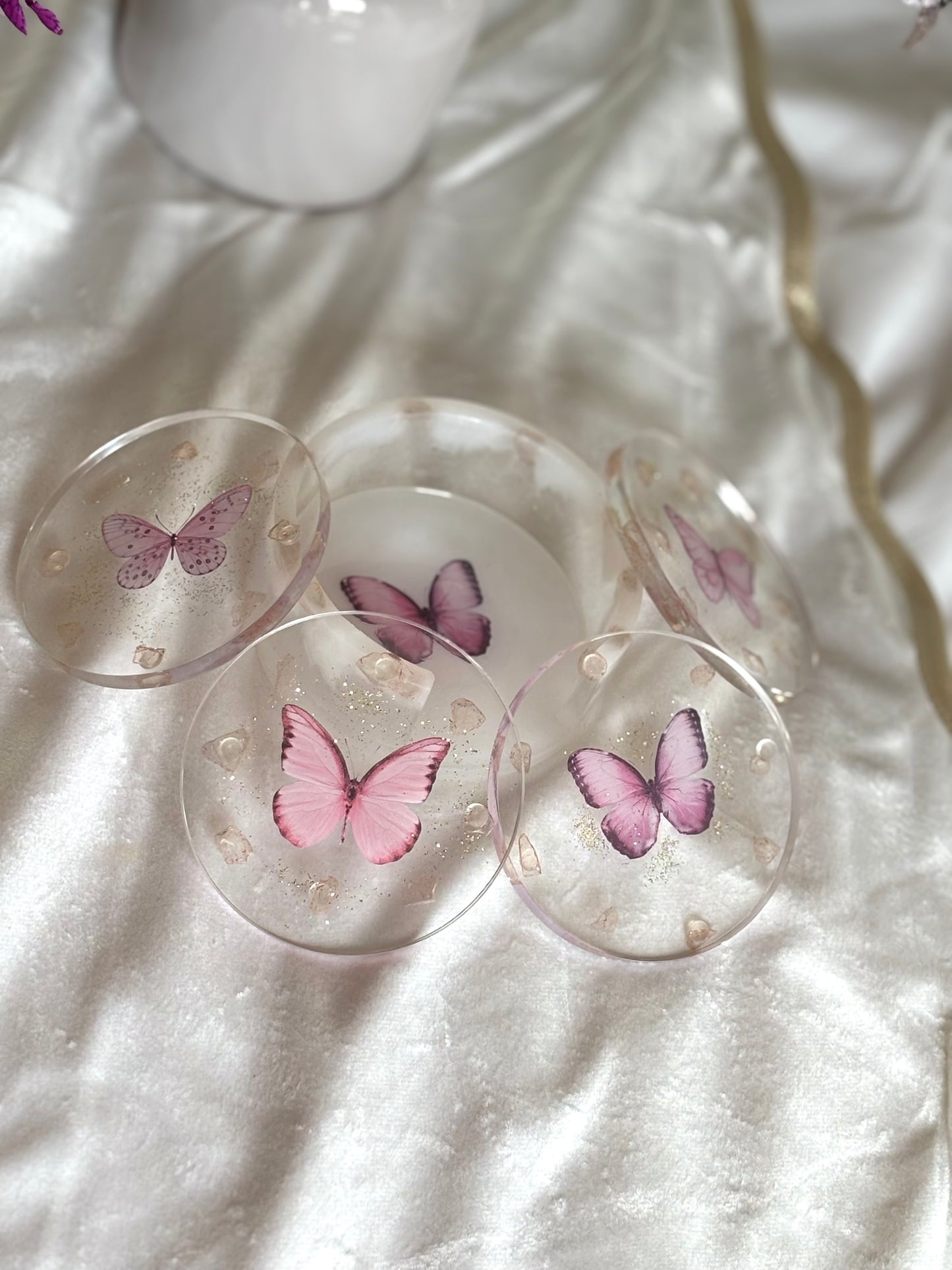 Pink butterfly resin coasters.